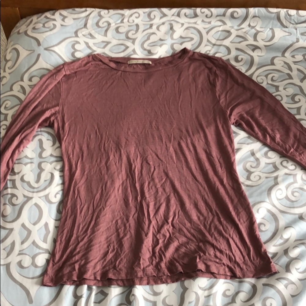 A loose fitting mauve shirt